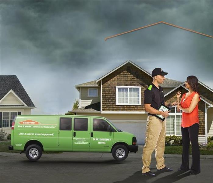 SERVPRO employee with homeowner