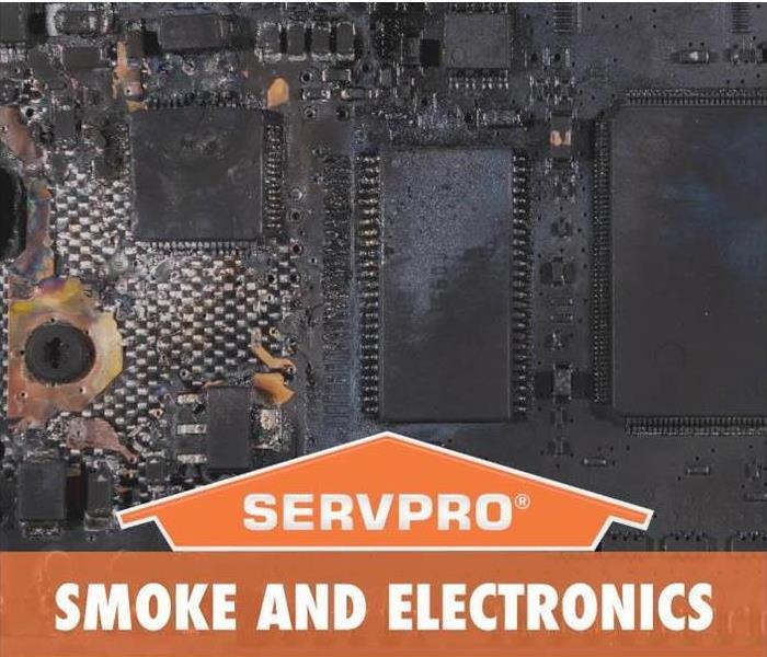 Smoke damaged electronics with SERVPRO logo